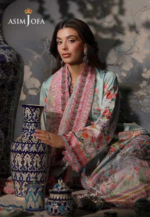 Asim Jofa AJCS-05 mint blue printed charmeuse silk suit – seated view with pink floral dupatta beside a blue and white vase