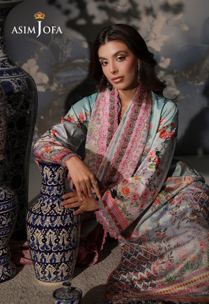 Asim Jofa AJCS-05 mint blue floral printed charmeuse silk suit – seated portrait with model resting her arm on a ceramic vase