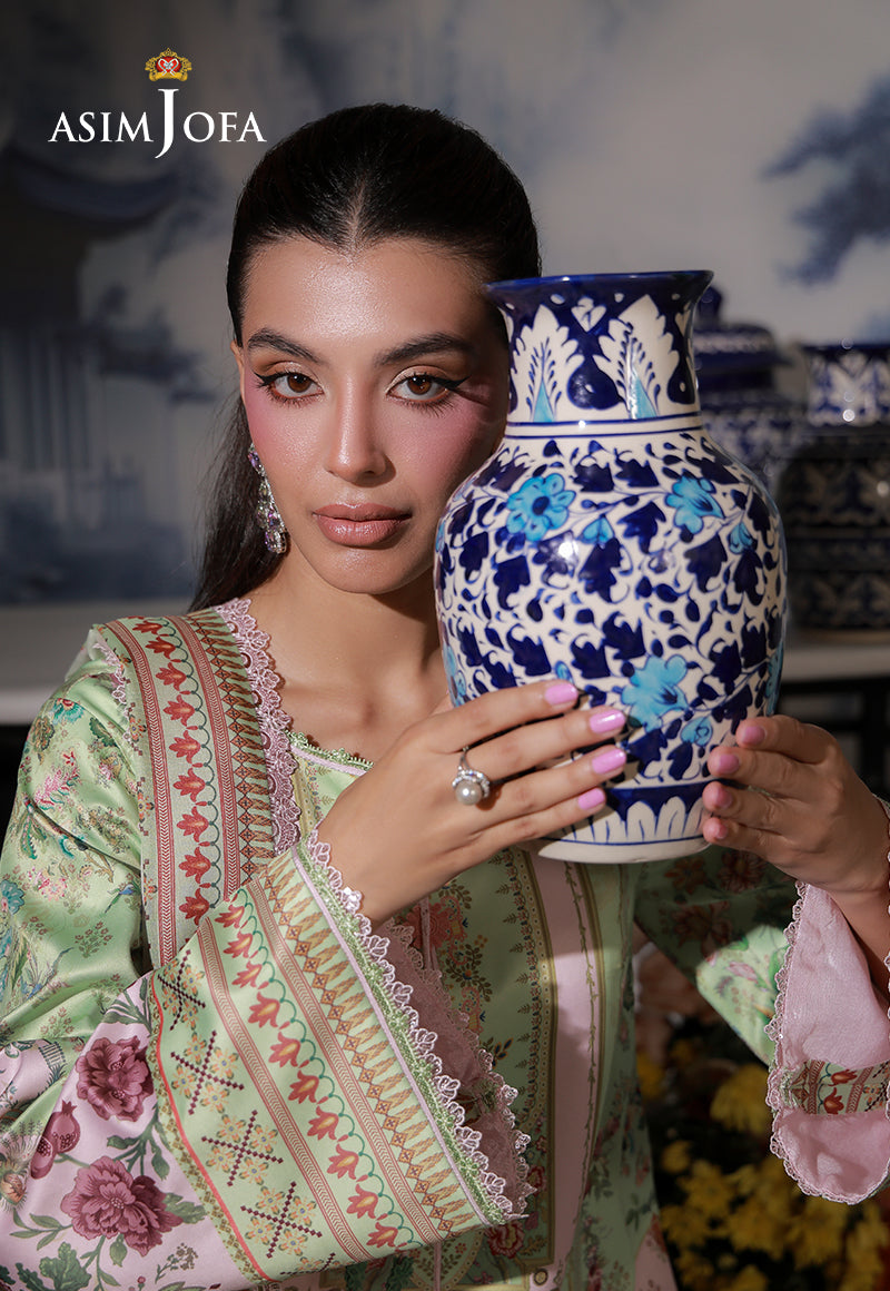 Asim Jofa AJCS-01 mint green floral printed charmeuse silk shirt – upper-body view with model holding a blue and white vase