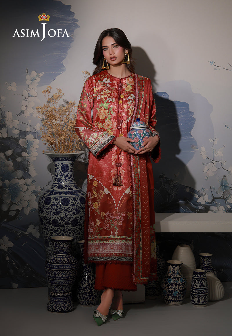 Asim Jofa AJCS-03 red-orange printed charmeuse silk 3-piece suit – full-length front view with model holding a ceramic jar