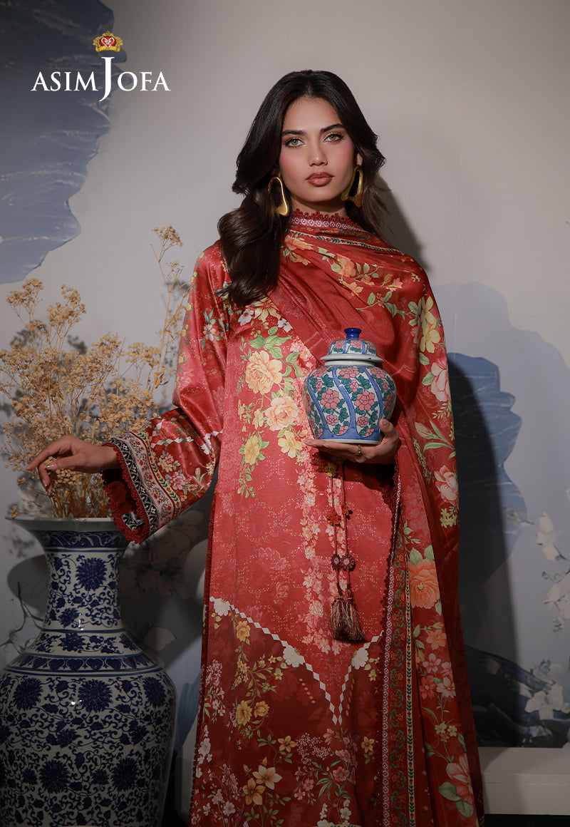 Asim Jofa AJCS-03 red-orange floral printed charmeuse silk suit – upper-body view with wrapped dupatta and ceramic jar