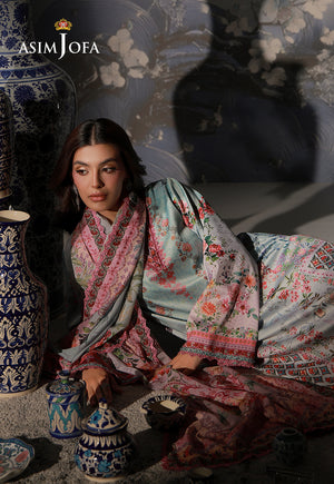 Asim Jofa AJCS-05 mint blue floral printed charmeuse silk suit – reclining view with pink dupatta beside decorative ceramic jars
