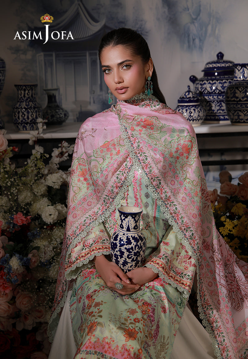 Asim Jofa AJCS-07 mint green floral printed charmeuse silk suit – front portrait with model holding a blue and white vase
