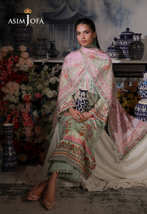 Asim Jofa AJCS-07 mint green printed charmeuse silk 3-piece suit – seated full-length view with pink dupatta and ceramic vase