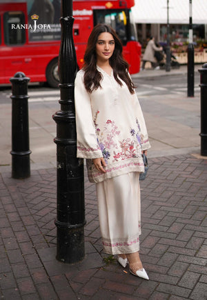 Rania Jofa Ivory Bloom RJPS-05 cream charmeuse silk floral printed shirt with matching shalwar – full length front facing London street view with red bus