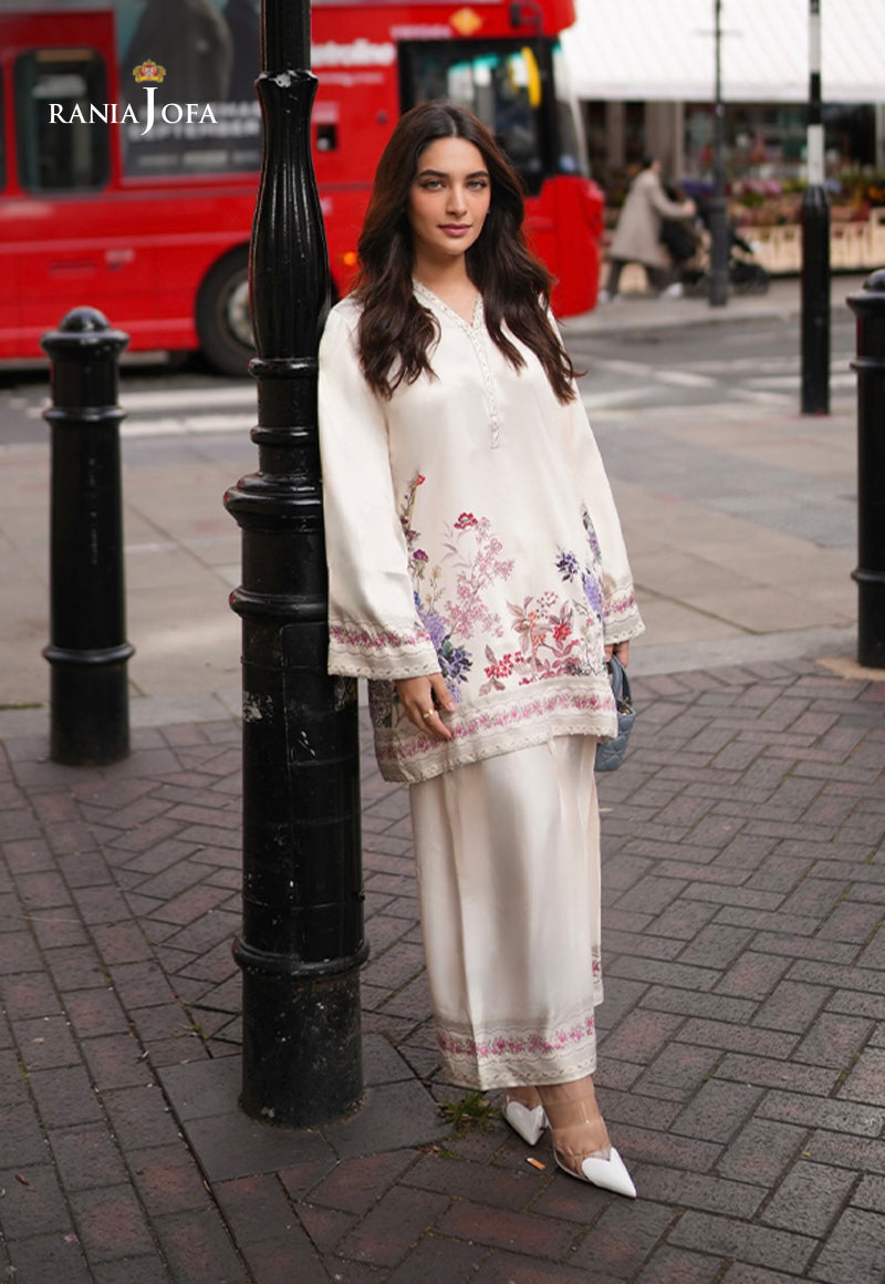 Rania Jofa Ivory Bloom RJPS-05 cream charmeuse silk floral printed shirt with matching shalwar – full length front facing London street view with red bus